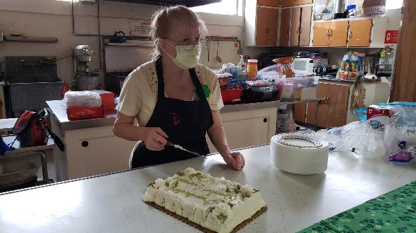 Lurine preparing cake